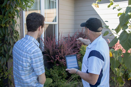 Home inspector reviewing findings with client